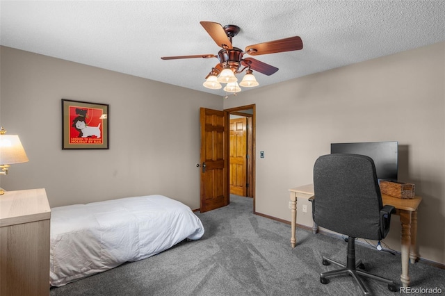 10520 W Jewell Ave Unit 102, Lakewood, CO 80232 - bedroom featuring ceiling fan, carpet flooring, and a textured ceiling