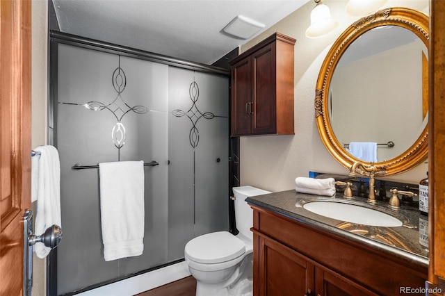 10520 W Jewell Ave Unit 102, Lakewood, CO 80232 - full bath with visible vents, vanity, an enclosed shower, and toilet
