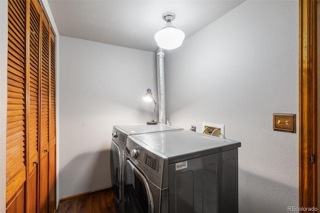 10520 W Jewell Ave Unit 102, Lakewood, CO 80232 - laundry room with independent washer and dryer, baseboards, dark wood-style floors, and laundry area