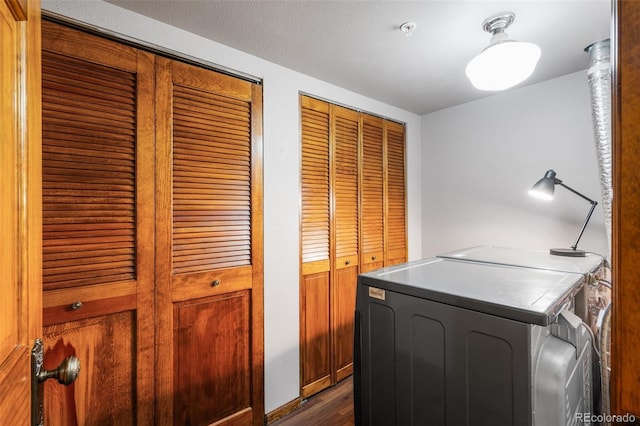 10520 W Jewell Ave Unit 102, Lakewood, CO 80232 - clothes washing area with dark wood-style floors, laundry area, and separate washer and dryer