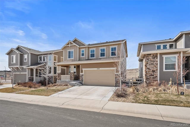 craftsman house featuring board and batten siding, concrete driveway, an attached garage, and stone siding