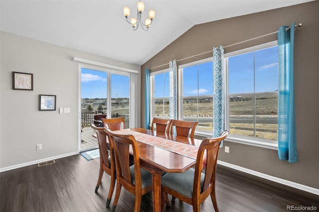 dining area with a wealth of natural light, visible vents, a notable chandelier, and vaulted ceiling