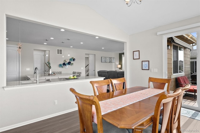 dining area with wood finished floors, visible vents, baseboards, recessed lighting, and vaulted ceiling