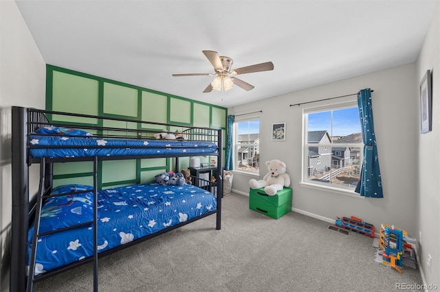 bedroom with baseboards and carpet floors