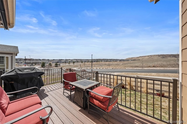 wooden deck with grilling area