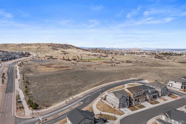 drone / aerial view featuring a mountain view