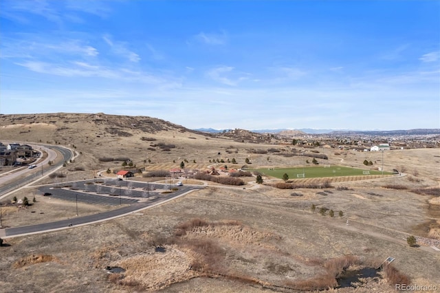 drone / aerial view featuring a mountain view