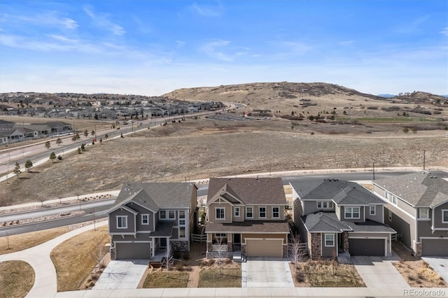 bird's eye view featuring a residential view and a mountain view