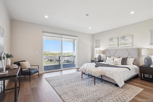 14337 Shasta Daisy Pt, Parker, CO 80134 - bedroom featuring access to exterior, wood finished floors, recessed lighting, and baseboards
