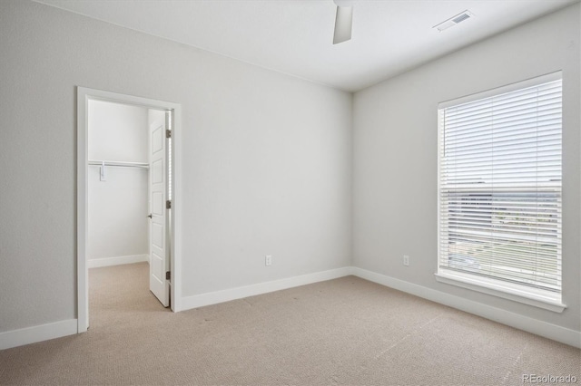 14337 Shasta Daisy Pt, Parker, CO 80134 - unfurnished bedroom featuring carpet, baseboards, a spacious closet, a ceiling fan, and a closet