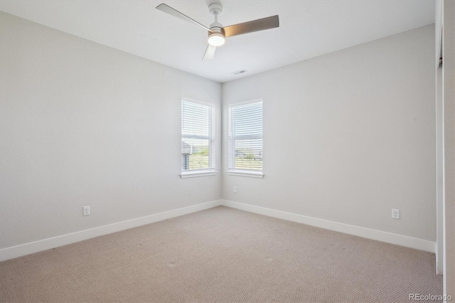 14337 Shasta Daisy Pt, Parker, CO 80134 - spare room featuring light colored carpet, baseboards, and ceiling fan