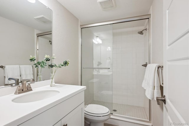 14337 Shasta Daisy Pt, Parker, CO 80134 - bathroom featuring a stall shower, vanity, and toilet