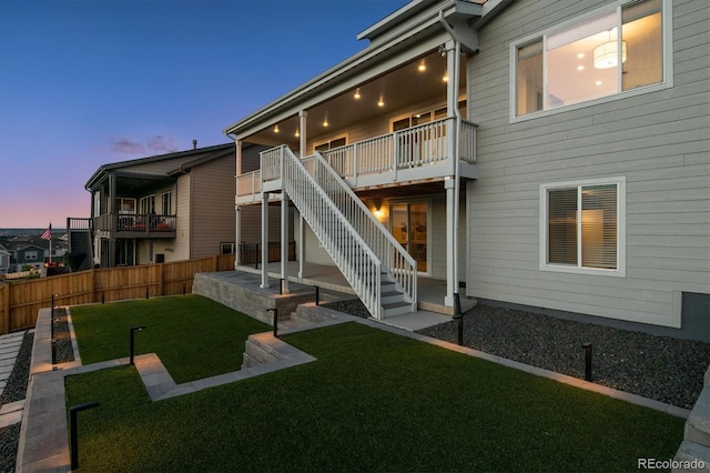 14337 Shasta Daisy Pt, Parker, CO 80134 - back of house at dusk featuring stairway