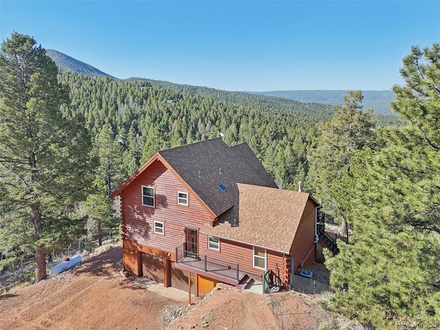 102 Douglas Fir Ln, Woodland Park, CO 80863 - drone / aerial view with a forest view