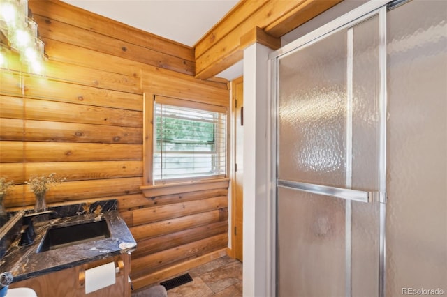 102 Douglas Fir Ln, Woodland Park, CO 80863 - full bath with vanity, rustic walls, and a stall shower