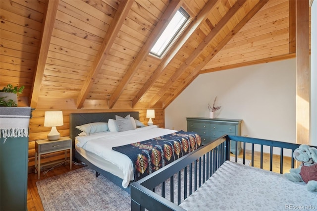 102 Douglas Fir Ln, Woodland Park, CO 80863 - bedroom with vaulted ceiling with skylight, wood finished floors, and wood ceiling