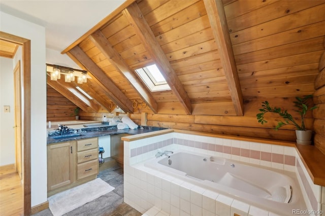 102 Douglas Fir Ln, Woodland Park, CO 80863 - bathroom with vanity, wooden ceiling, beamed ceiling, a skylight, and a garden tub