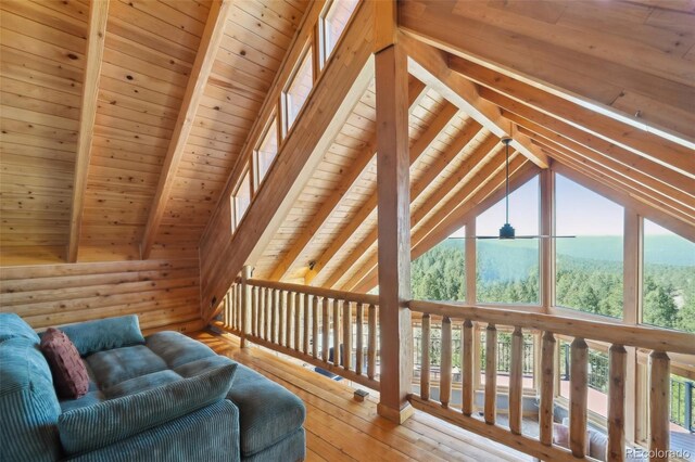 102 Douglas Fir Ln, Woodland Park, CO 80863 - interior space featuring lofted ceiling with beams, wooden ceiling, and wood-type flooring