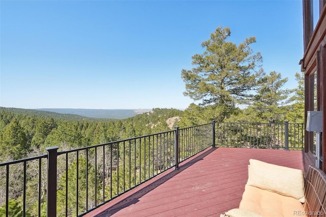 102 Douglas Fir Ln, Woodland Park, CO 80863 - wooden deck featuring a wooded view