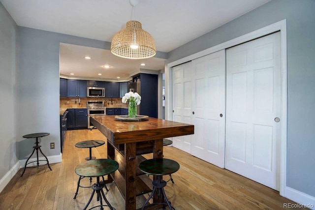 dining space with light wood-type flooring