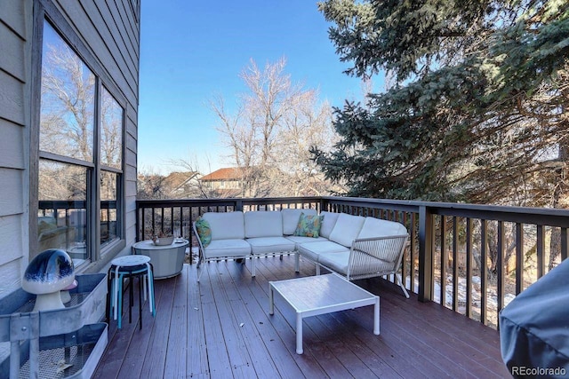 deck with outdoor lounge area and grilling area