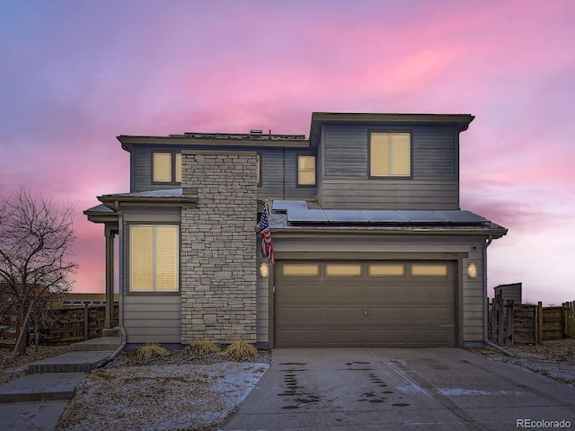 view of front of property featuring a garage