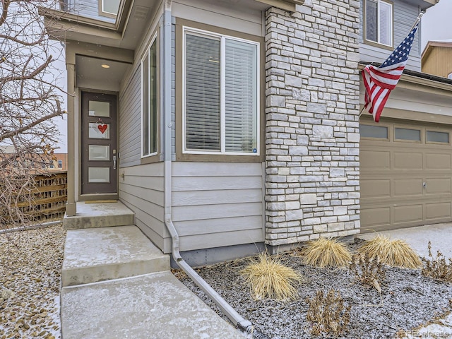 property entrance with a garage