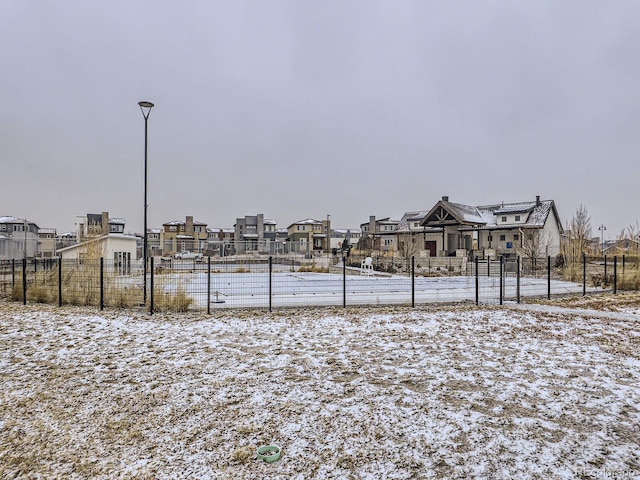 view of yard layered in snow