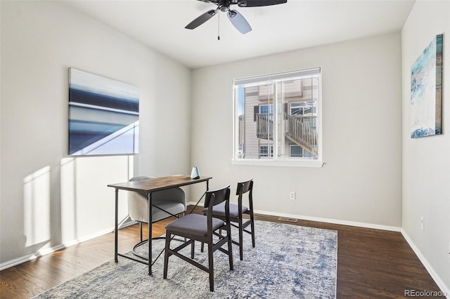 dining area with ceiling fan and wood-type flooring