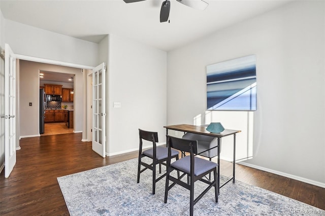 dining space with dark hardwood / wood-style flooring, french doors, and ceiling fan