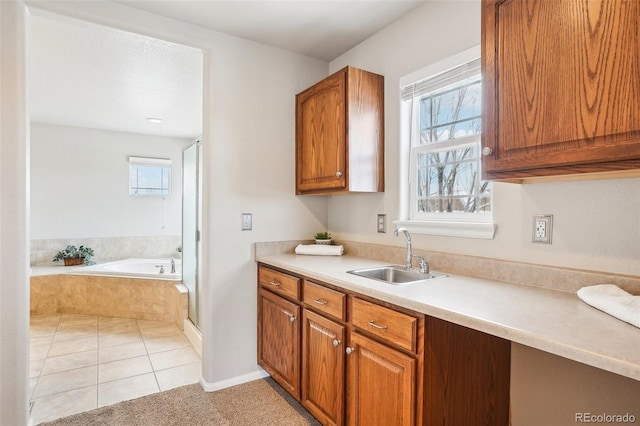 kitchen with sink and light tile patterned flooring