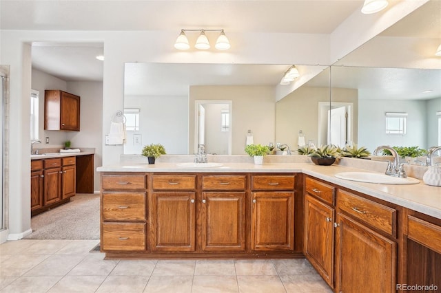 bathroom with walk in shower, tile patterned floors, and vanity