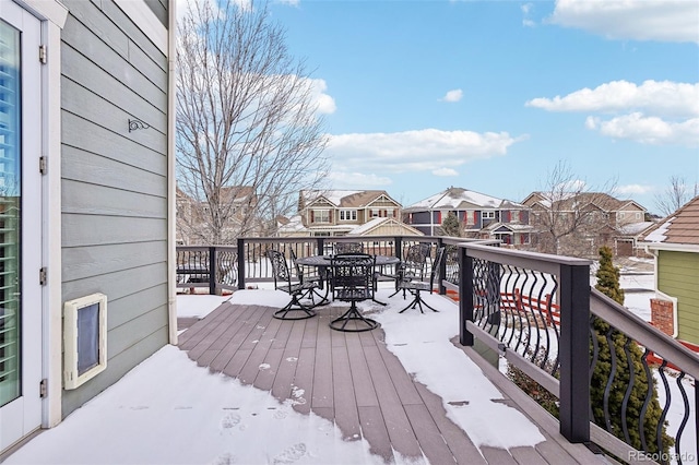 view of snow covered deck