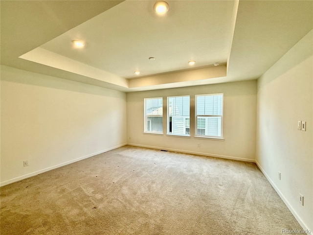 9041 Redfield Ln, Parker, CO 80134 - spare room with a raised ceiling, light carpet, baseboards, and recessed lighting