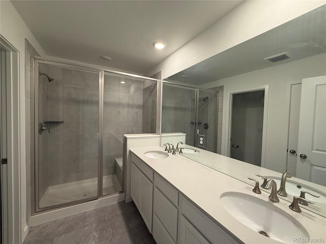 9041 Redfield Ln, Parker, CO 80134 - bathroom featuring a stall shower, double vanity, and tile patterned floors