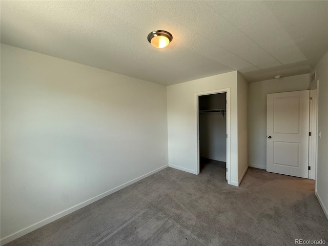 9041 Redfield Ln, Parker, CO 80134 - unfurnished bedroom featuring carpet, baseboards, a closet, and a textured ceiling