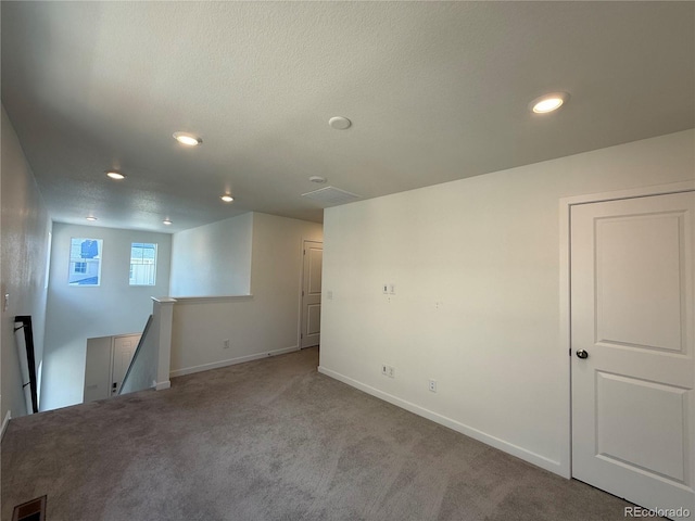 9041 Redfield Ln, Parker, CO 80134 - below grade area with carpet, baseboards, recessed lighting, and a textured ceiling
