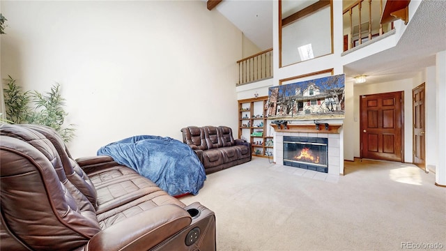 carpeted living area with high vaulted ceiling, beamed ceiling, and a fireplace