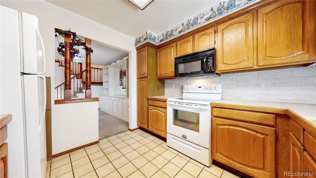 kitchen with tile countertops, white appliances, tasteful backsplash, and brown cabinetry