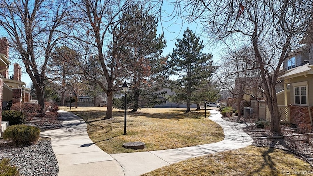 view of home's community featuring a lawn