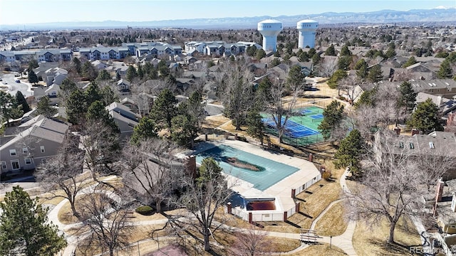 drone / aerial view featuring a residential view and a mountain view