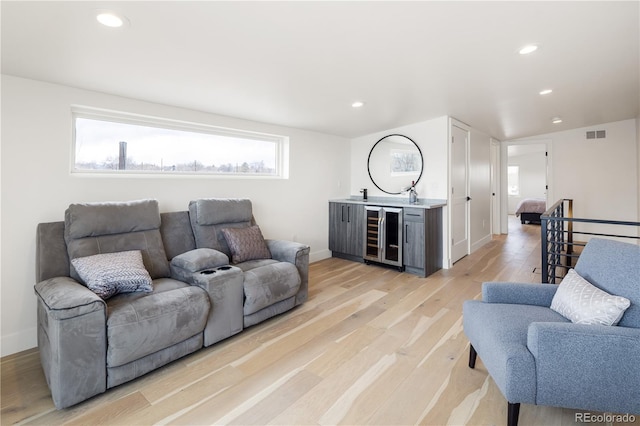1953 W 47th Ave, Denver, CO 80211 - living area with wine cooler, recessed lighting, light wood finished floors, and visible vents