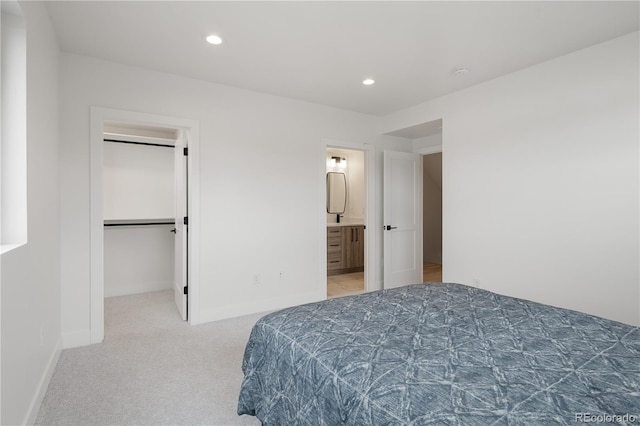 1953 W 47th Ave, Denver, CO 80211 - carpeted bedroom with recessed lighting, connected bathroom, baseboards, and a spacious closet