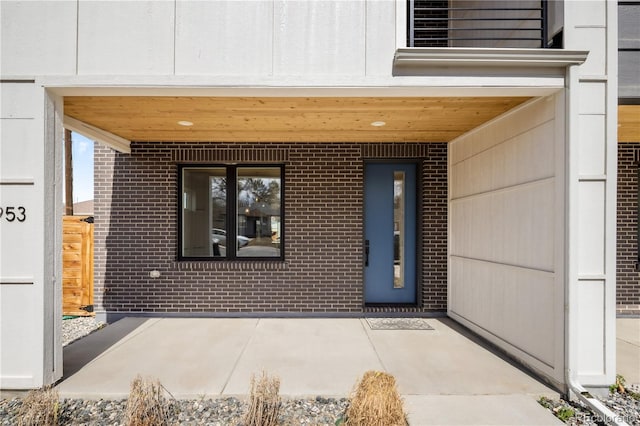 1953 W 47th Ave, Denver, CO 80211 - property entrance with a patio and brick siding
