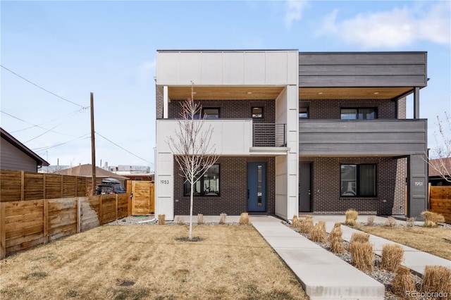 1953 W 47th Ave, Denver, CO 80211 - modern home featuring brick siding, fence, and a balcony