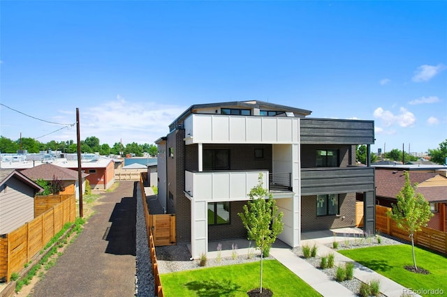 1953 W 47th Ave, Denver, CO 80211 - contemporary house featuring a balcony and a patio area