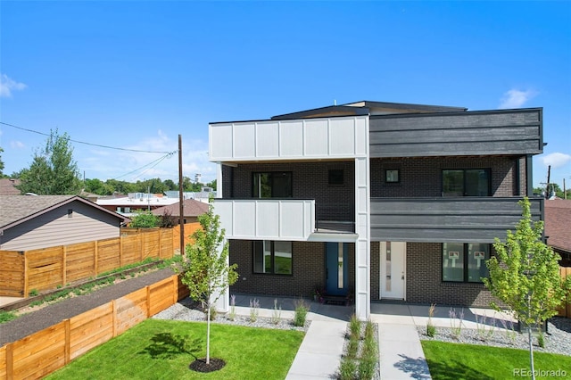 1953 W 47th Ave, Denver, CO 80211 - modern home with a balcony and brick siding