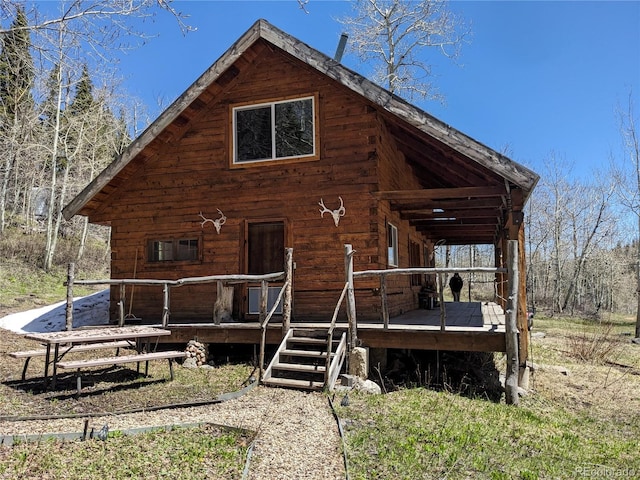 back of property with covered porch