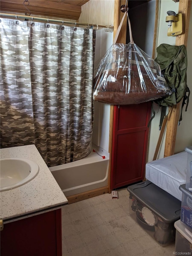 bathroom with shower / bath combo and vanity