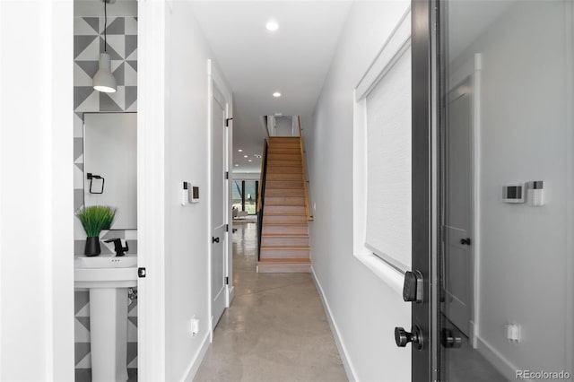 3409 Navajo St, Denver, CO 80211 - corridor with finished concrete floors, baseboards, recessed lighting, and stairs